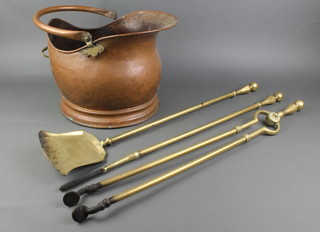 A 19th Century brass 3 piece fireside companion set comprising poker, tongs and shovel together with a copper helmet shaped coal scuttle 