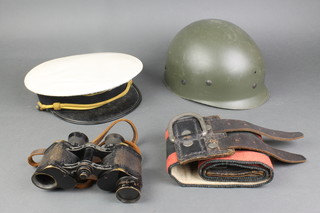 A plastic helmet liner, a small cloth girth and a Continental military cap (f) 