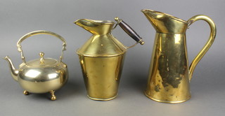 A Dresser style brass jug with turned ebony handle 8", a brass waisted jug 9 1/2", a circular brass kettle 