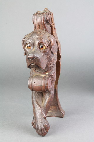 A 19th century carved fruit wood Swiss novelty nut cracker in the form of a St. Bernard dog