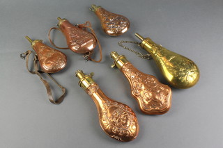 A collection of 6 reproduction copper and brass powder flasks 