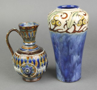A Doulton Lambeth salt glazed jug, the base incised WH 6" together with a Royal Doulton blue glazed vase with stylised decoration, the base incised HS 7 1/2" 