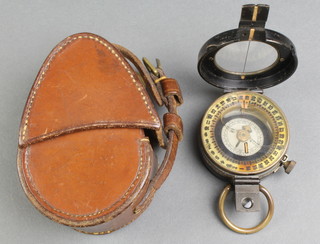 Dolland of London, a prismatic military style compass, patent 29677/10 110002/16 complete with leather case 