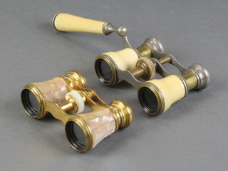 A pair of French gilt metal and mother of pearl opera glasses together with 1 other pair of opera glasses
