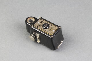A Coronet Midget camera contained in a black Bakelite case 