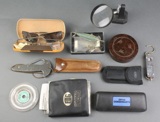 A Hardy Bros. brown Bakelite cylindrical fly box and a collection of flies, a Hardy Bros. metal folding gaff, a wallet of flies, 2 multipurpose tools etc and a lure 
