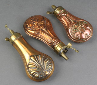 3 reproduction copper and brass powder flasks with embossed decoration 