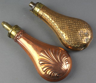 A 19th Century brass shot flask by Dixon together with a copper and brass shot flask with shell decoration 