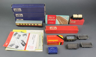 2 Hornby Dublo carriages D12 boxed, a Hornby Dublo Corridor coach D22 boxed and a small collection of rolling stock, a Dublo brochure etc 
