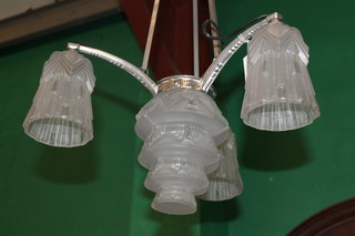 An Art Deco chromium plated 3 light electrolier with opaque glass shades