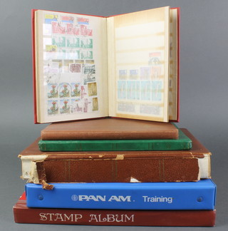 A stock book of Elizabeth II used GB stamps, 1 other  used world stamps, a brown stockbook of used world stamps, 3 small stock books of used world stamps 