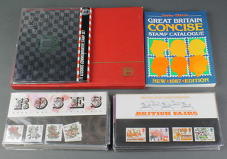 A stock book of Elizabeth II mint stamps and a collection of presentation stamps