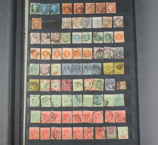 A stock book of used GB stamps including 3 twopenny blues, 6 penny reds and other GB stamps 