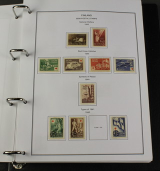 An album of mint and used stamps Finland 1858-2006