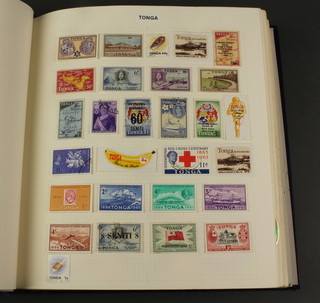 An album of mint and used world stamps Tokelau, Tonga, Trinidad & Tobago, Tristan Da Cunha , Uganda, Zanzibar etc 