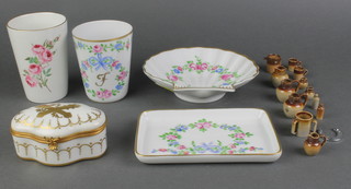 A rectangular Limoges porcelain pin tray with floral decoration 5 1/2", matching scallop shaped dish 5 1/2", ditto beaker, an old Foley beaker, Continental shaped porcelain trinket box and cover 3 1/2", 6 miniature graduated salt glazed jugs (3 have damaged handles), 2 miniature salt glazed mugs (1 damaged) and a Lladro figure of a reclining angel.
