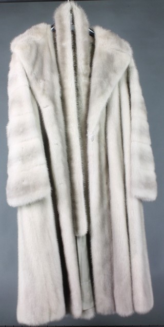 A lady's full length silver mink jacket by Deanfield of London and a fur hat and collar