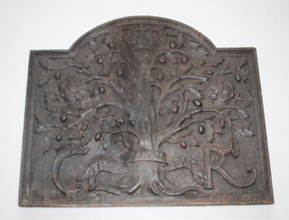 An arched iron fire back decorated an oak tree and Charles II cypher and marked The Royal Oak 29" x 35" 
