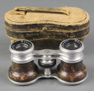 A pair of Dollond chrome cased opera glasses, complete with leather outer case