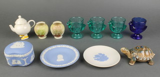 3 French pressed green glass egg cups in the form of hens 3", ditto blue, 2 circular Wedgwood Jasperware ashtrays 4", a Wedgwood blue Jasperware jar and cover 2", a trinket box in the form of a tortoise 3", 2 Carlton Ware vases marked Lucky Heather 2" and a Beswick novelty teapot 3" 
