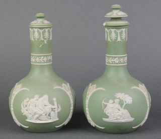 A pair of Wedgwood green Jasperware bottle shaped vases and covers, bases impressed Wedgwood 6" 