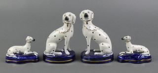 A pair of 19th Century Staffordshire figures of seated Dalmatians 5" and a pair of ditto recumbent Hounds 2" 