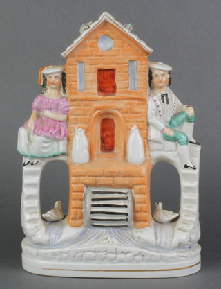 A 19th Century Staffordshire flatback figure group of a watermill 9" 
