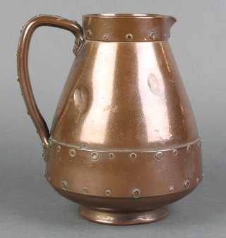 A Doulton Silica vase in the form of a copper jug, the base impressed 7047, 7"