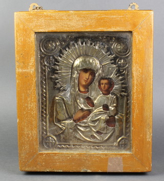 A 19th Century Icon on board of The Madonna and Child contained within an embossed silver riza 8 1/2" x 7"