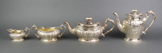 A good repousse silver 4 piece tea and coffee set with ivory mounts approx. 1970 grams 