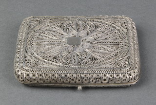 A Persian silver filigree cigarette case with formal scrolling decoration, 63 grams 