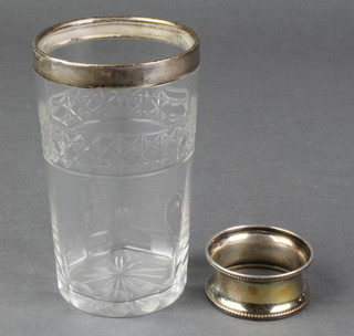 A silver mounted glass beaker Birmingham 1927, a ditto napkin ring 