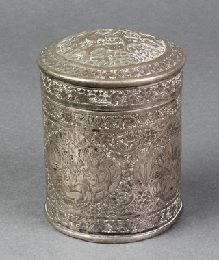 A Persian repousse silver cylindrical box decorated with panels of deer, birds and rabbits 4" 