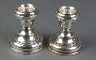 A pair of silver dwarf candlesticks with waisted stems, Birmingham 1933 2 1/4" 
