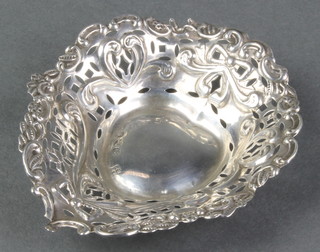 A Victorian repousse silver heart shaped bon bon dish with ribbon and scroll decoration, Chester 1896 3 3/4" 