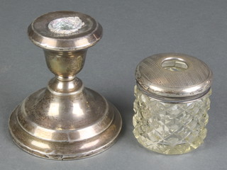 A silver waisted stem dwarf candlestick Birmingham 1920 4", a silver mounted glass hair tidy 