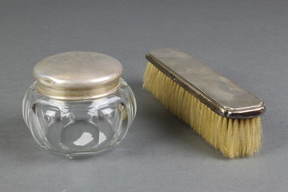 A silver mounted globular toilet jar, London 1913 3 1/2" and a silver backed clothes brush