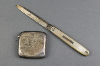 An Edwardian silver vesta with scroll decoration, Birmingham 1905 and a silver and mother of pearl fruit knife 