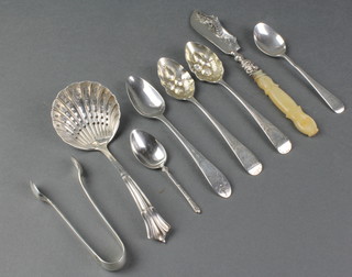 A Victorian silver butter knife with mother of pearl handle, a silver sifter spoon, 5 others and a pair of nips, weighable silver 111 grams 