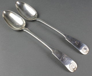 A pair of George III silver gravy spoons with shell terminals, Edinburgh 1817 with chased initial 