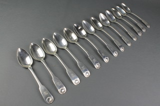 13 George IV silver fiddle pattern dessert spoons with shell ends and engraved initial, Edinburgh 1823/24, 15 ozs 