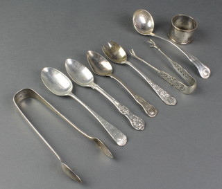 A pair of Victorian silver bright cut sugar nips, Glasgow 1874, 1 other pair, a sauce ladle, 4 spoons and a napkin ring, 8 ozs 