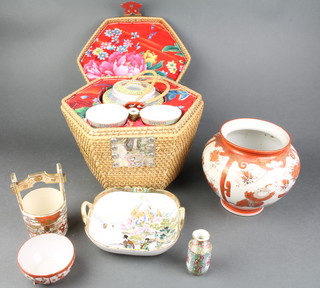 A Kutani vase of melon form with panel decoration decorated birds 6" (chip to rim), a Satsuma bucket shaped vase with 4 character mark to base 5" (cracked), a Canton famille rose rollo vase 3", a Kutani cup (f), a Noritake twin handled bowl 6", a famille rose teapot and 2 tea bowls contained in a wicker basket 