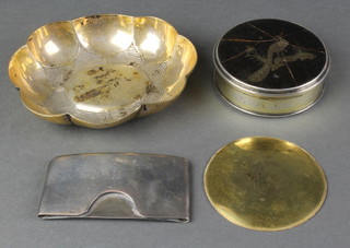 A circular silver and tortoiseshell pique trinket box, the lid decorated a peacock 2 1/2", a silver card holder and a scalloped gilt dish 