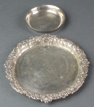 A Victorian silver card tray with repousse scroll rim 5", Sheffield 1897 5 1/2", a silver nut dish 3", 140 grams 