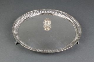 A silver plated circular salver 12" and a silver mounted toilet jar 1" 