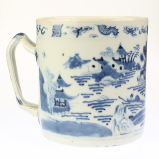 An 18th Century Chinese blue and white porcelain mug with strap handle decorated pagodas, 4"h 