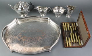 A silver plated quatrefoil tray 19", a 3 piece plated tea set and minor items 