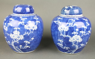 A pair of Chinese blue and white hawthorn pattern ginger jars and covers 7"