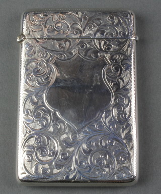 A chased silver card case with scroll decoration and vacant cartouche Birmingham 1913, 3 1/2", 55 grams